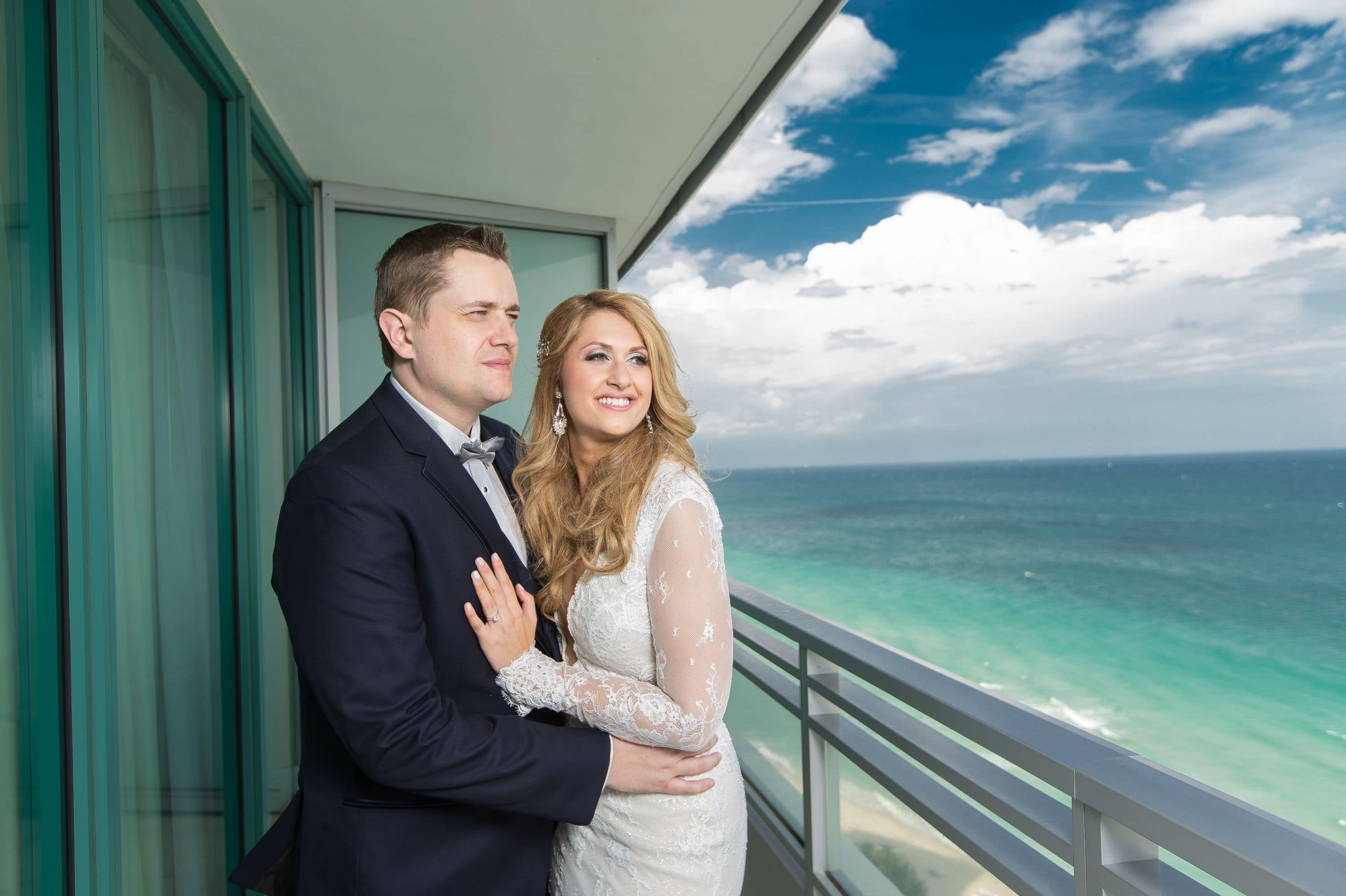 Bride and groom during a Diplomat Beach Resort Wedding take a moment to admire the view