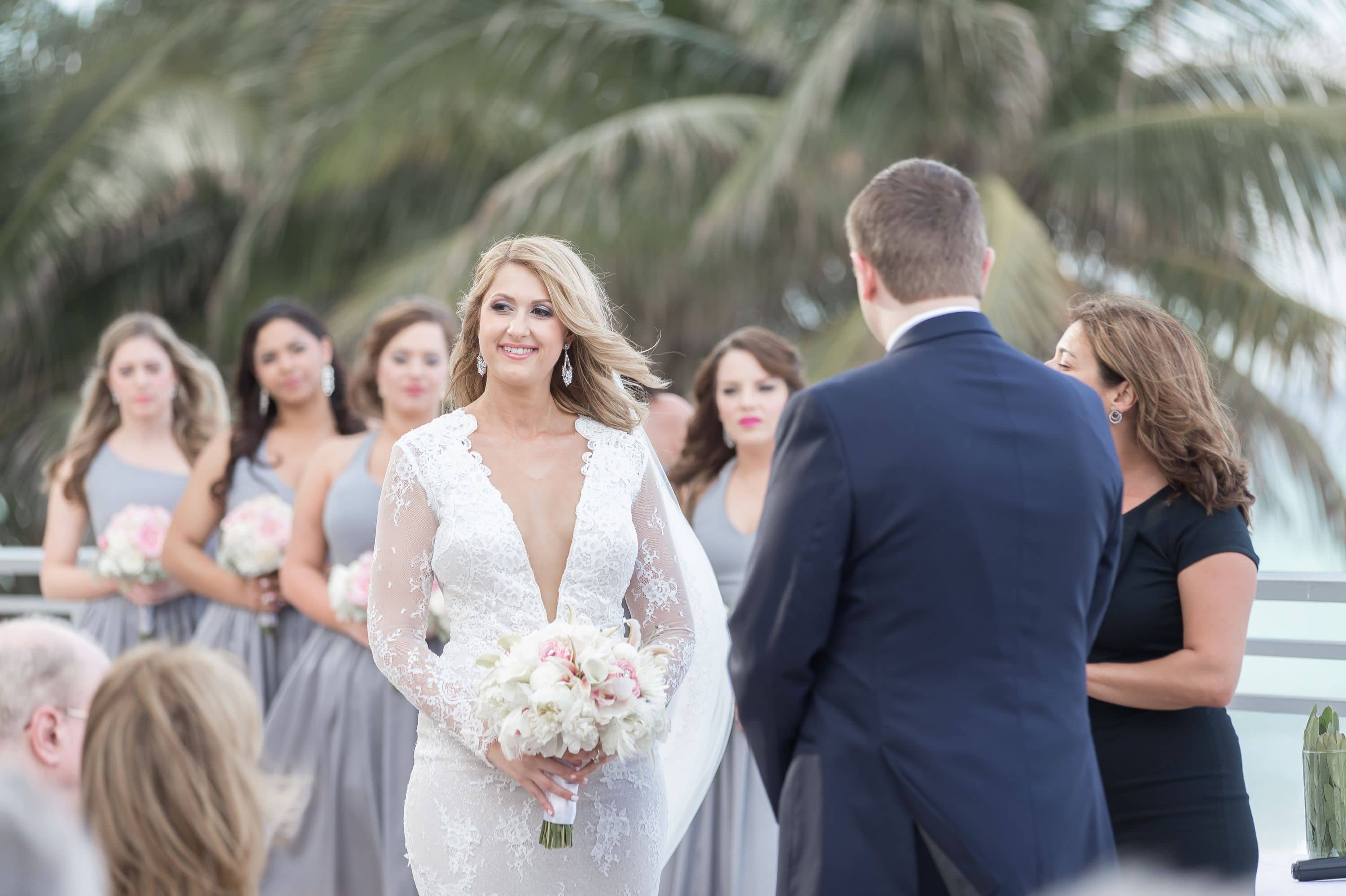 Some candid shots of the bride during the ceremony at this Diplomat Beach Resort Wedding