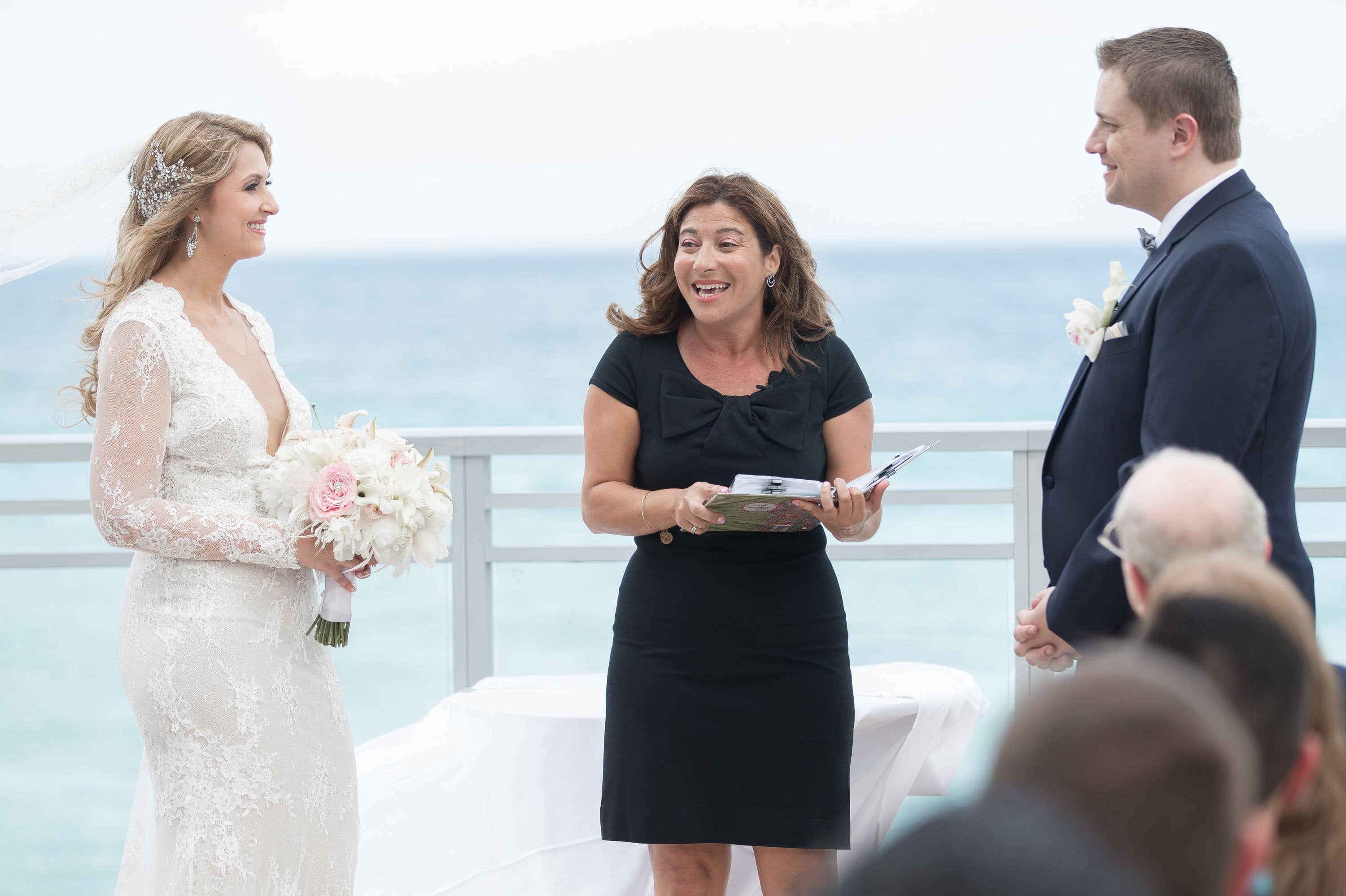 A photo showing bride and groom with the ocean view at this Diplomat Beach Resort Wedding