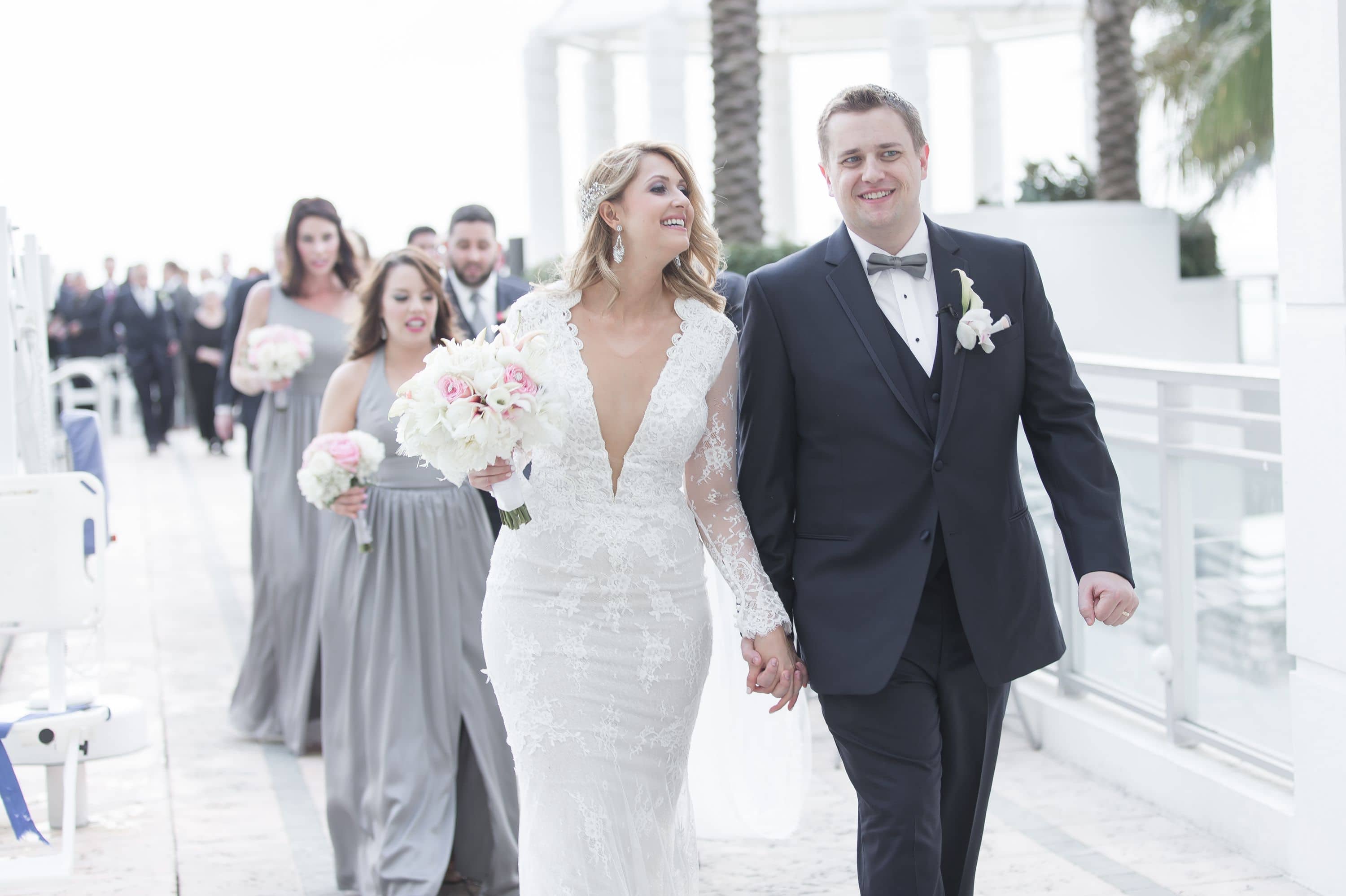 Candid shot of bride and groom after ceremony at this Diplomat Beach Resort Wedding